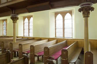 Interior. S Side Pews and gallery columns. Detail