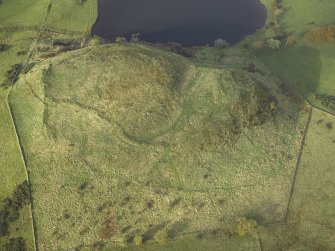 Oblique aerial view centred on the remains of the fort, taken from the ESE.