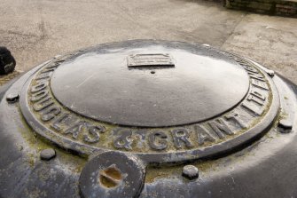 Detail.  Top of Capstan showing name of makers 'Douglas & Grant Ltd Kirkcaldy 1917'.