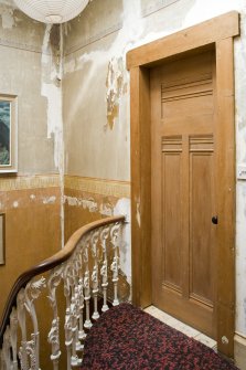 Interior. First floor. View of stair balustrade and stenciled decoration