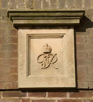 Detail.  carved stone plaque 'G R VI with crown' on central block of main Sandhurst Barrack.