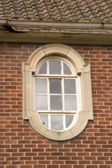 Detail.  Oval window with stone surround on S elevation of main Sandhurst Barrack Block.