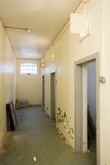 Interior.  Detail of corridor outside cells.