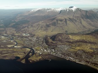 General oblique aerial view centred on the town with Ben Nevis in the distance, taken from the WNW.