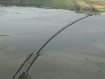 Oblique aerial view centred on the road bridge, taken from the ESE.