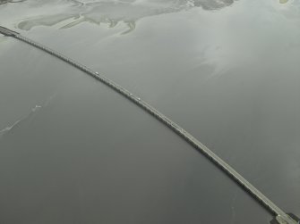 Oblique aerial view centred on the road bridge, taken from the NE.