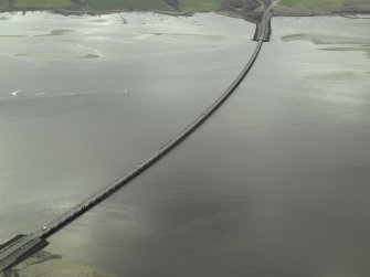 Oblique aerial view centred on the road bridge, taken from the NW.