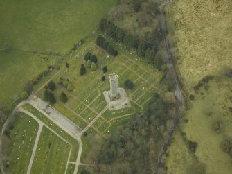Oblique aerial view centred on the memorial and cemetery, taken from the NNE.
