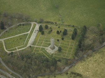 Oblique aerial view centred on the memorial and cemetery, taken from the NW.