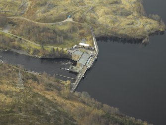 Oblique aerial view centred on the dam and electricity generating station, taken from the N.