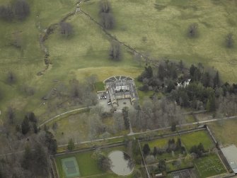 Oblique aerial view centred on the country house, taken from the NW.