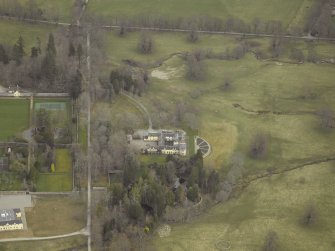 Oblique aerial view centred on the country house, taken from the SW.