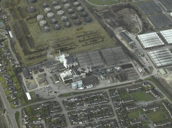 Oblique aerial view centred on the whisky distilleries, taken from the ENE.