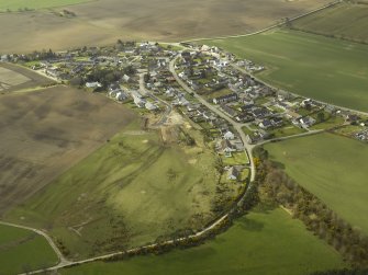 Oblique aerial view centred on the village, taken from the N.