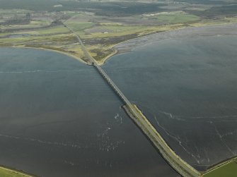 Oblique aerial view centred on the road bridge, taken from the SW.