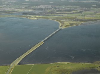 Oblique aerial view centred on the road bridge, taken from the SE.