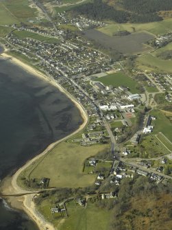 Oblique aerial view of the town centred on the church, manse and burial-ground, taken from the E.