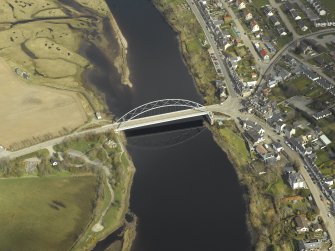 Oblique aerial view centred on the road bridge with the hotel adjacent, taken from the S.