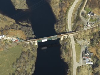 Oblique aerial view centred on the railway viaduct with the railway station adjacent, taken from the SSE.