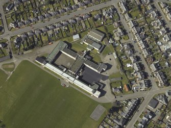 Oblique aerial view centred on the school, taken from the ESE.