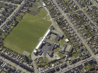 Oblique aerial view centred on the school, taken from the NE.