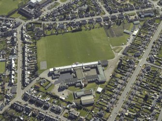 Oblique aerial view centred on the school, taken from the NNW.