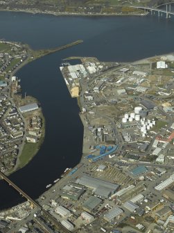 General oblique aerial view centred on the shipyard and harbour, taken from the SE.