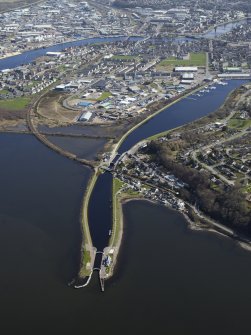 Inverness, Caledonian canal. General oblique aerial view centred on the canal, locks, swing bridge and canal basins, taken from the WNW.