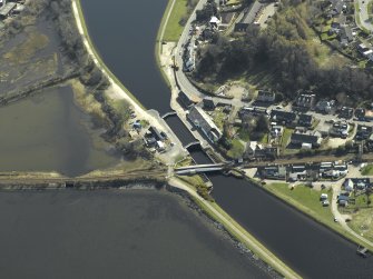 Oblique aerial view centred on the lock, swing bridge and workshops, taken from the N.