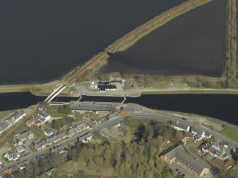 Oblique aerial view centred on the lock, swing bridge and workshops, taken from the SW.