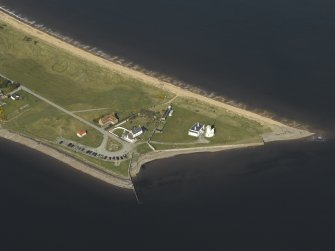 Oblique aerial view centred on Chanonry Point Lighthouse, cottages and ferry house, taken from the S.