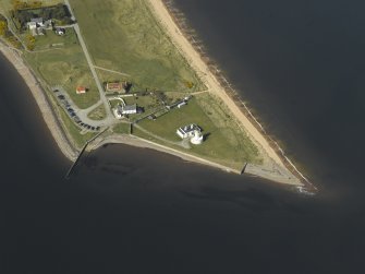 Oblique aerial view centred on the lighthouse, cottages and ferry house, taken from the SSE.