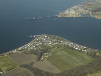 General oblique aerial view centred on the town, oil pipeline terminal and fabrication yard, taken from the SSW.