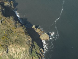 Oblique aerial view centred on the remains of the gun-emplacements and searchlight battery, taken from the SE.