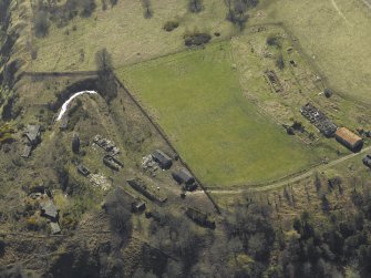 Oblique aerial view centred on the remains of the coast battery with the naval signal station adjacent, taken from the NE.