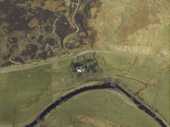 Oblique aerial view centred on the church and the remains of the broch, taken from the S.