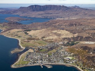 General oblique aerial view centred on the town with Ben More Coigach in the distance, taken from the SE.