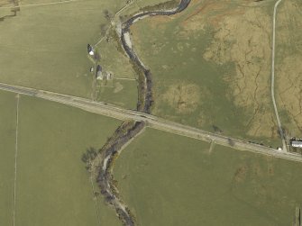 Oblique aerial view centred on the road bridges, taken from the WSW.