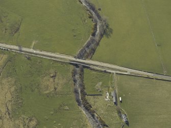 Oblique aerial view centred on the road bridges, taken from the ENE.