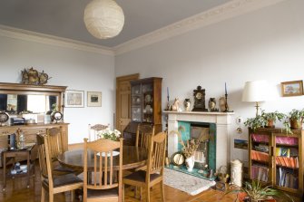 Interior. Sample flat, showing dining room (former main bedroom), showing marble mantlepiece and cornice