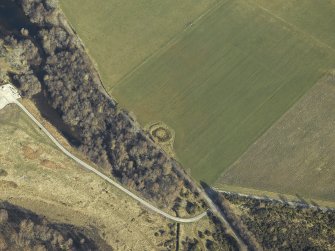 Oblique aerial view centred on the remains of the henge, taken from the SE.