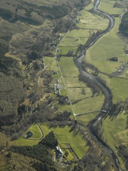 General oblique aerial view centred on the country house, watermill, road bridge and township, taken from the W.