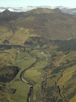 General oblique aerial view looking towards Sgurr a¿ Mhuilinn centred on the country house, watermill, road bridge and township with the church in the foreground, taken from the E.