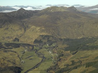 General oblique aerial view looking towards Sgurr a¿ Mhuilinn centred on the country house, watermill, road bridge and township, taken from the E.