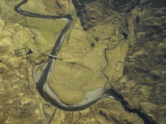 Oblique aerial view centred on the road bridge and the remains of the townships and sheepfolds, taken from the W.