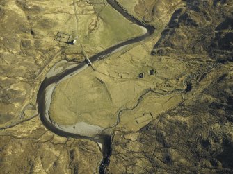 Oblique aerial view centred on the road bridge and the remains of the townships and sheepfolds, taken from the SW.