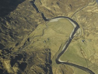 Oblique aerial view centred on the road bridge and the remains of the townships and sheepfolds, taken from the ENE.