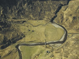 Oblique aerial view centred on the road bridge and the remains of the townships and sheepfolds, taken from the NNE.