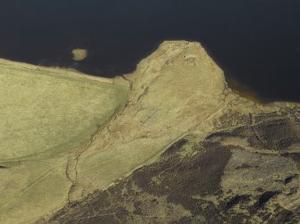 Oblique aerial view centred on the remains of the farmstead and rig, taken from the S.