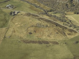 Oblique aerial view centred on the remains of the fort with the school adjacent, taken from the E.
